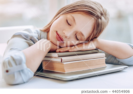 Charming little female having rest after lessons 44054906
