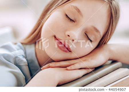 Close up of dreamy girl that keeping eyes closed 44054907