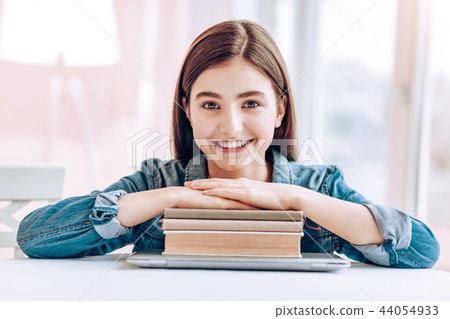 Amazing female person holding hands on books Amazing female person holding hands on books 44054933