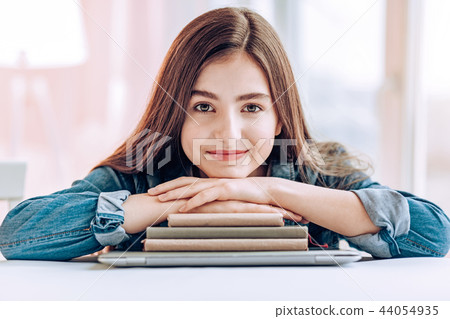 Portrait of delighted girl that looking straight at camera Portrait of delighted girl that looking straight at camera 44054935