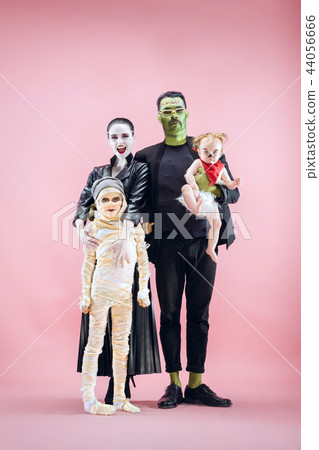 Halloween Family. Happy Father, Mother and Children Girls in Halloween Costume and Makeup Halloween Family. Happy Father, Mother and Children Girls in Halloween Costume and Makeup 44056666