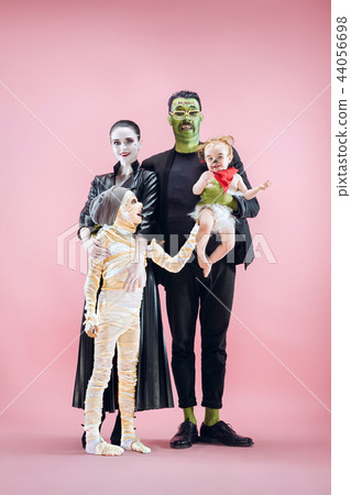 Halloween Family. Happy Father, Mother and Children Girls in Halloween Costume and Makeup Halloween Family. Happy Father, Mother and Children Girls in Halloween Costume and Makeup 44056698