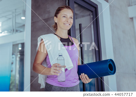 Jolly mature woman engaging in active sport 44057717