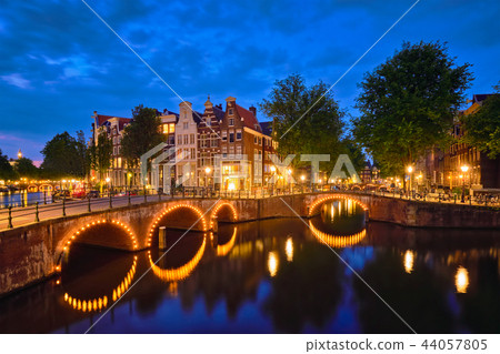 Amterdam canal, bridge and medieval houses in the evening 44057805