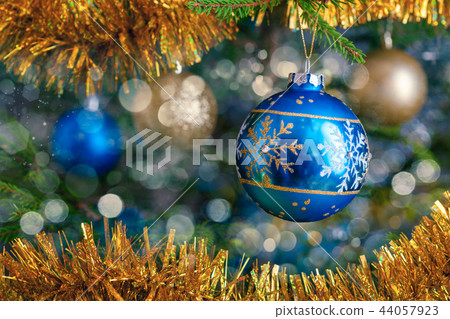 Christmas-tree decoration bauble on decorated Christmas tree bac Christmas-tree decoration bauble on decorated Christmas tree bac 44057923