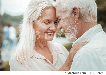 Close up of charming woman that keeping eyes closed Close up of charming woman that keeping eyes closed 44057924