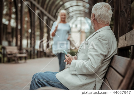 Serious bearded man waiting for his girlfriend Serious bearded man waiting for his girlfriend 44057947
