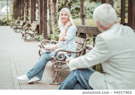 Pretty blonde woman having rest on bench Pretty blonde woman having rest on bench 44057968