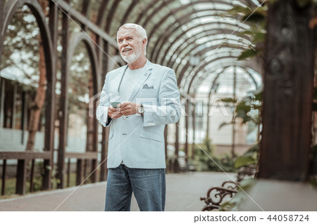 Attentive blonde male person being in park 44058724