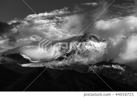 Kazbek top view from stepantsminda village. Georgia mountain peak. Black and white 44058725