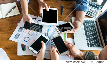people working or play on smart phone under warm l people working or play on smart phone under warm l 44059084