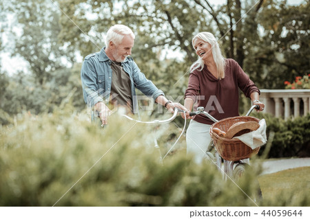 Joyful mature people spending weekend on bicycles 44059644