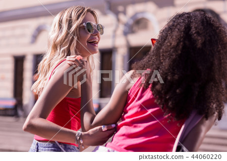 Happy joyful women enjoying their time together Happy joyful women enjoying their time together 44060220