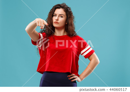 The overbearing business woman point you and want you, half length closeup portrait on blue 44060517