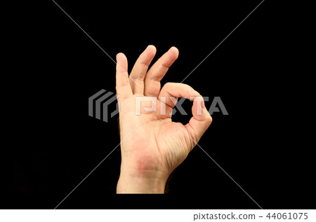 The hand of the person shows gesture ok or everything is good 44061075