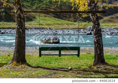 swing for relaxing on the banks of the river swing for relaxing on the banks of the river 44061614