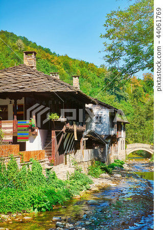 Houses on the Bank of a River Houses on the Bank of a River 44061769