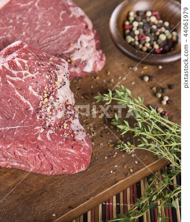 Raw beef steak with spices 44061979