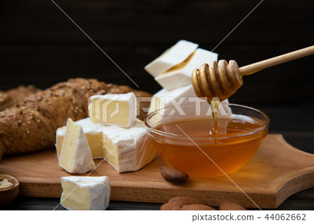 slices of cheese brie or camembert with croissants 44062662
