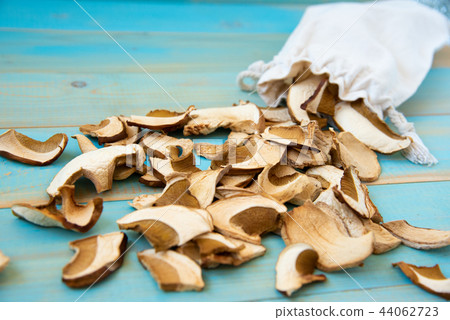 dried mushrooms on old wooden blue background 44062723