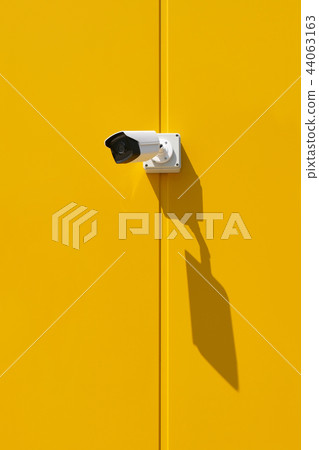 Security camera at a wall 44063163