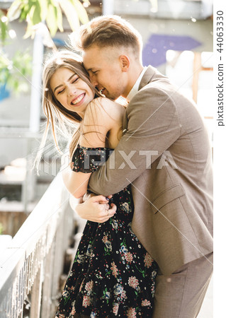 Young couple in love posing on camera Young couple in love posing on camera 44063330