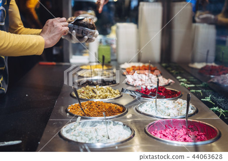 table with different cold snacks, a buffet table with different cold snacks, a buffet 44063628