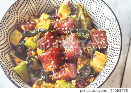 Bowl of poke - traditional Hawaiian dish Bowl of poke - traditional Hawaiian dish 44063778
