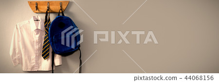 School uniform and schoolbag hanging on hook 44068156
