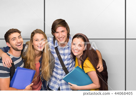 Composite image of students holding folders at college corridor Composite image of students holding folders at college corridor 44068405