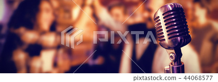 Composite image of close-up of microphone Composite image of close-up of microphone 44068577