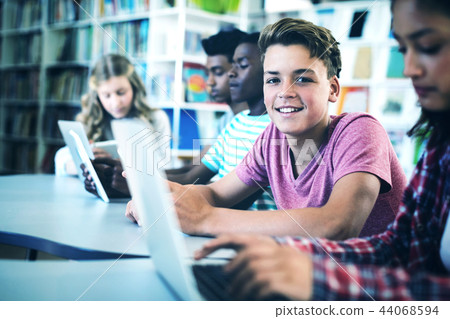 Students using laptop, digital tablet Students using laptop, digital tablet 44068594
