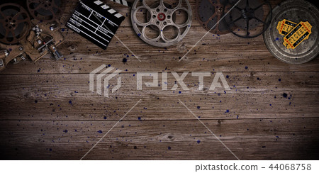 Cinema concept of vintage film reels, clapperboard and projector. 44068758