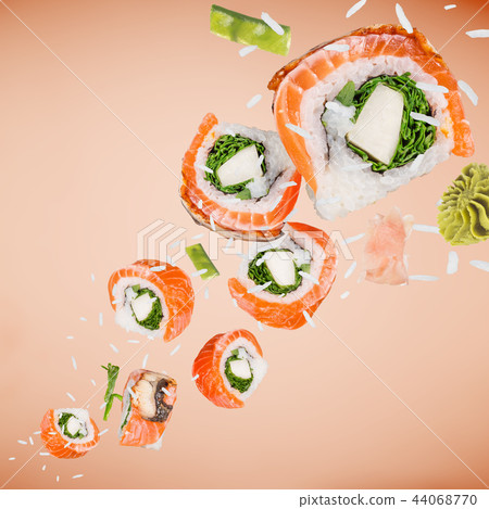 Pieces of delicious japanese sushi frozen in the air. Pieces of delicious japanese sushi frozen in the air. 44068770