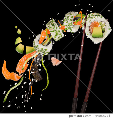 Pieces of delicious japanese sushi frozen in the air. Pieces of delicious japanese sushi frozen in the air. 44068771