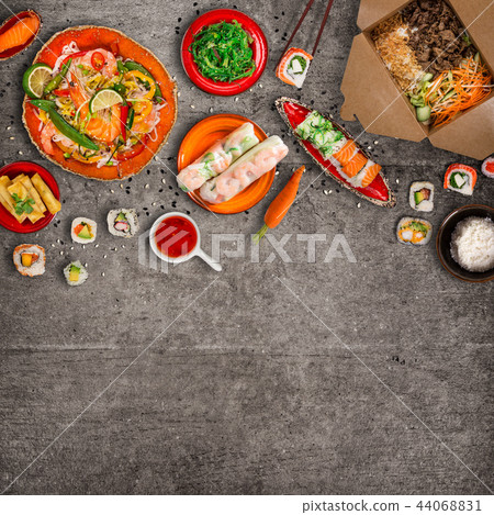 Various of asian meals on rustic background , top view , place for text. Various of asian meals on rustic background , top view , place for text. 44068831