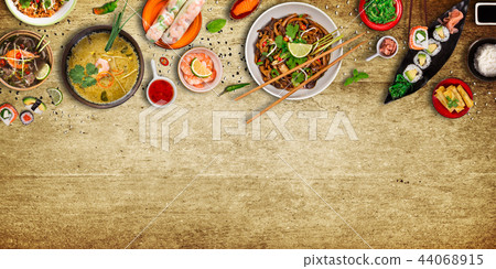 Various of asian meals on rustic background , top view , place for text. Various of asian meals on rustic background , top view , place for text. 44068915