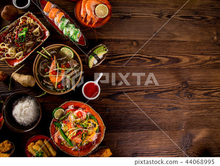 Various of asian meals on rustic background , top view , place for text. Various of asian meals on rustic background , top view , place for text. 44068995