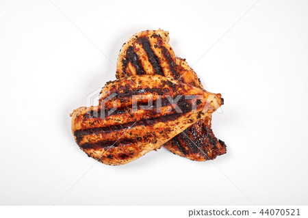 Chicken breast. Grilled fillet pieces isolated on white background. Chicken breast. Grilled fillet pieces isolated on white background. 44070521