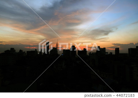 Sunset over the city with clouds sky. Sunset over the city with clouds sky. 44072183