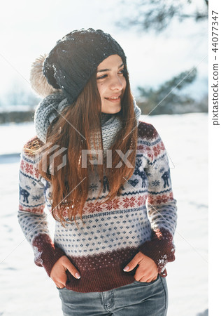 a Beautiful young woman in winter outside a Beautiful young woman in winter outside 44077347
