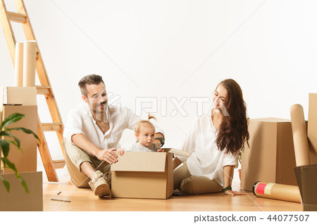 Couple moving to a new home - Happy married people buy a new apartment to start new life together Couple moving to a new home - Happy married people buy a new apartment to start new life together 44077507