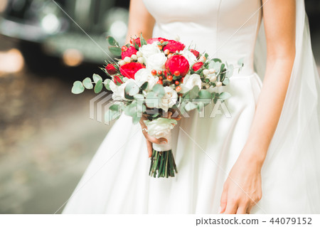 Portrait of a beautiful fashion bride, sweet and sensual. Wedding make up and hair Portrait of a beautiful fashion bride, sweet and sensual. Wedding make up and hair 44079152