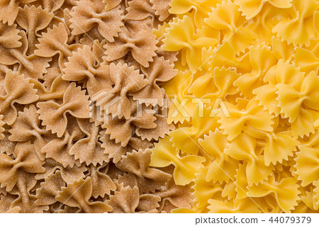 Wholewheat farfalle pasta. Tasty italian pasta. Wholewheat farfalle pasta. Tasty italian pasta. 44079379
