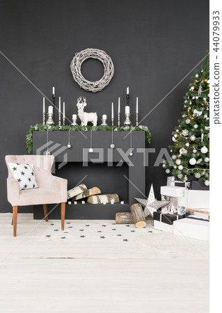 Christmas postcard template. Chimney place with candles. Copy space, black background. 44079933