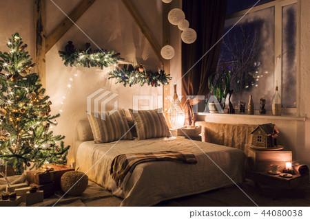 warm and cozy evening in living room. Sofa bed In christmas Interior. concept the new year and warm and cozy evening in living room. Sofa bed In christmas Interior. concept the new year and 44080038