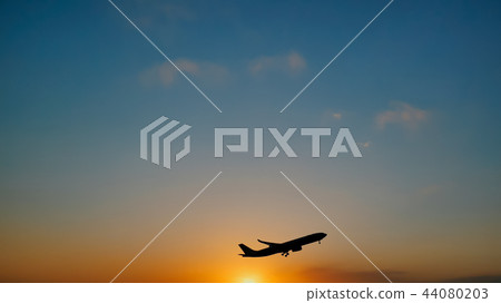 Plane taking off sky sunset sun dusk in airport 44080203