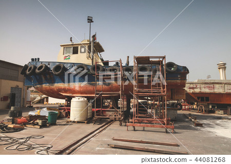 Old tugboat for repair at dock, Aqaba 44081268