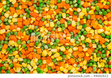 Frozen diced vegetables background Frozen diced vegetables background 44082622