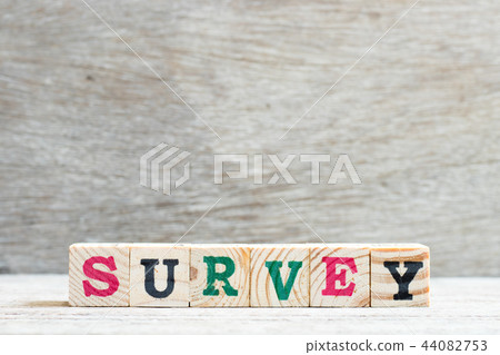 Letter block in word survey on wood background Letter block in word survey on wood background 44082753